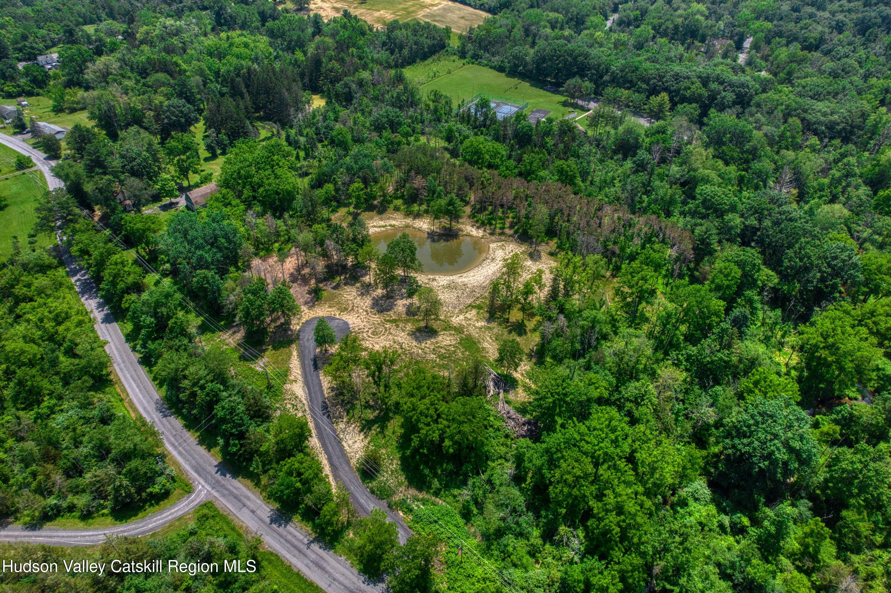 0 Adams Road Coxsackie, NY 12051 - Photo 15 of 23 an aerial view of residential house with outdoor space and trees all around