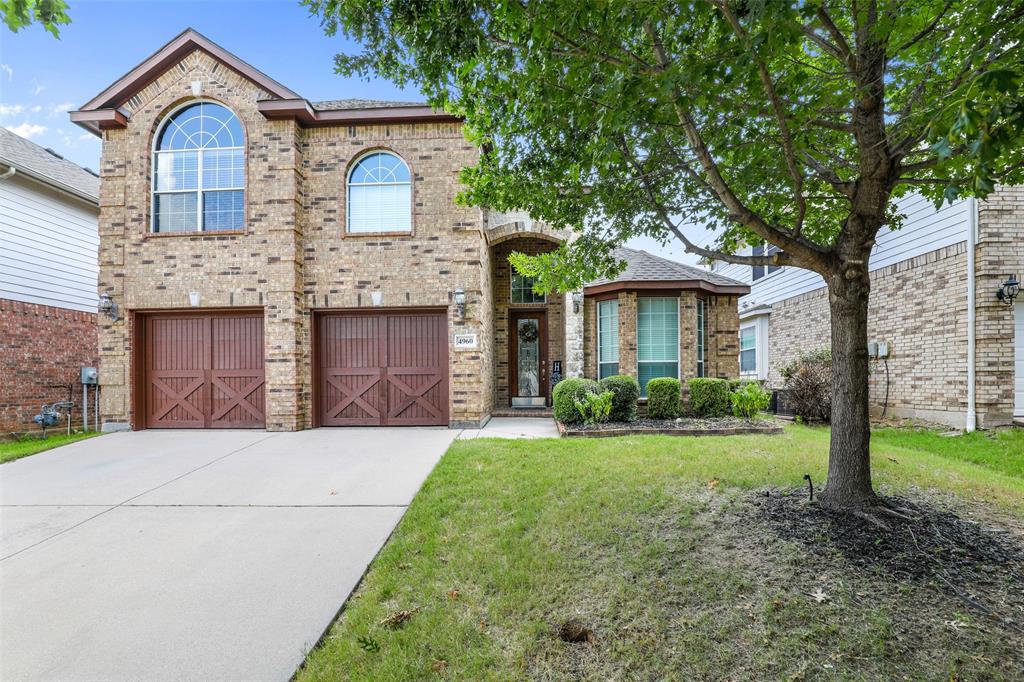 4960 Obrien Way Fort Worth, TX 76244 - Photo 1 of 1 a front view of a house with a yard and garage