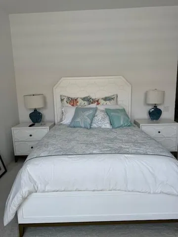 a bedroom with a bed and a couch