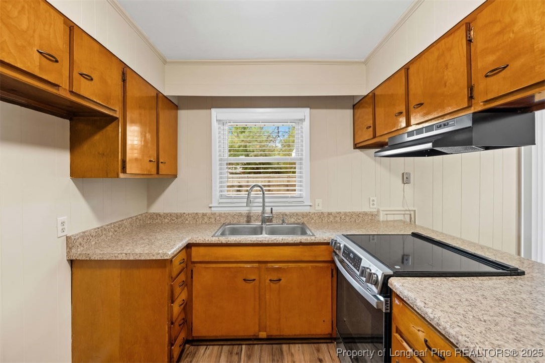 3918 Glenridge Road Fayetteville, NC 28304 - Photo 11 of 31 a kitchen with stainless steel appliances granite countertop a sink stove and cabinets