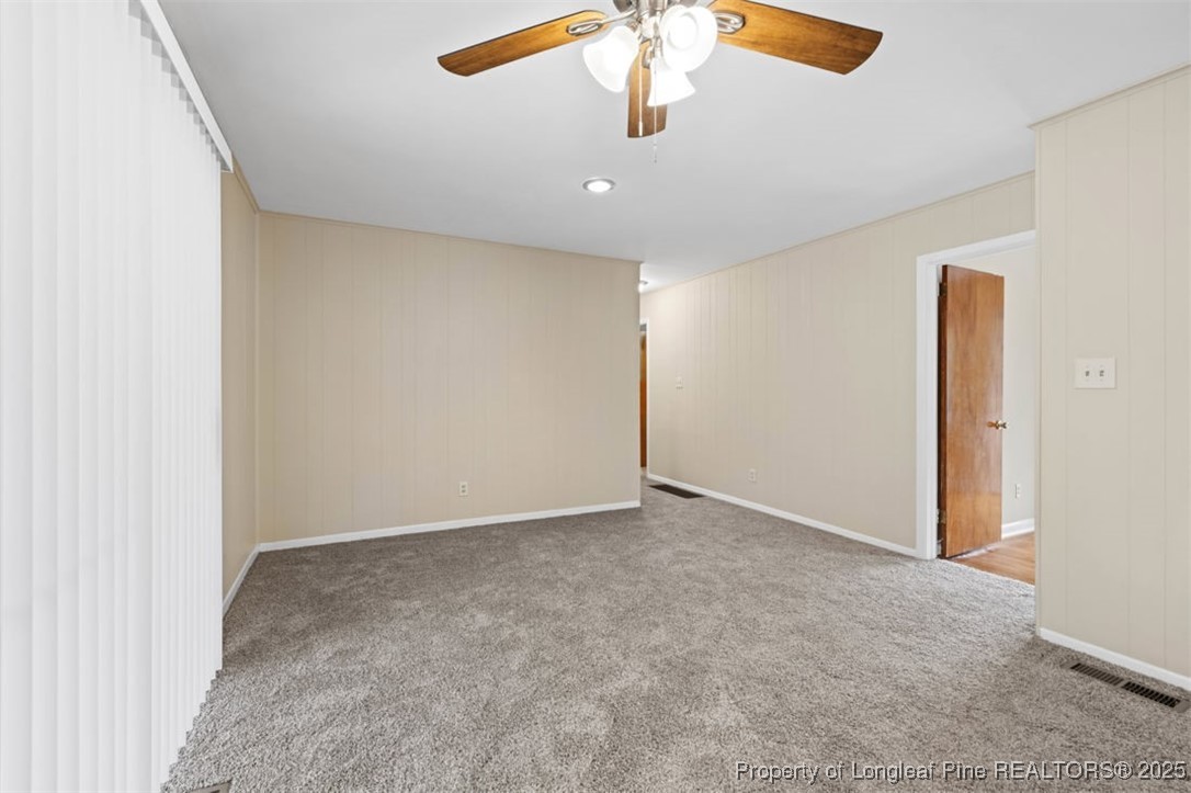 3918 Glenridge Road Fayetteville, NC 28304 - Photo 13 of 31 an empty room with a chandelier fan
