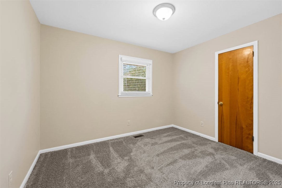 3918 Glenridge Road Fayetteville, NC 28304 - Photo 14 of 31 an empty room with a window