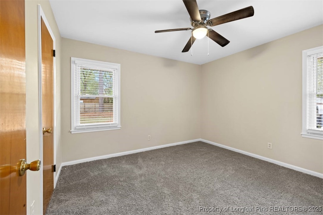 3918 Glenridge Road Fayetteville, NC 28304 - Photo 16 of 31 an empty room with windows and fan