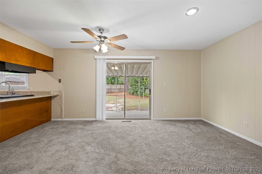 3918 Glenridge Road Fayetteville, NC 28304 - Photo 20 of 31 a view of a livingroom with a ceiling fan and window