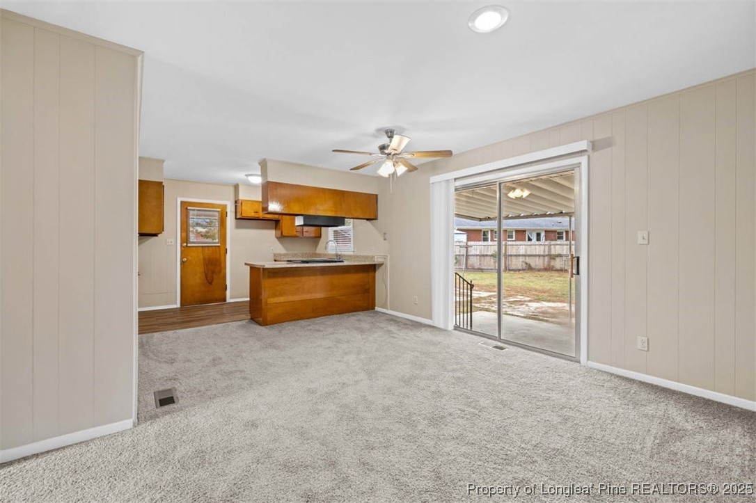 3918 Glenridge Road Fayetteville, NC 28304 - Photo 21 of 31 an empty room with furniture and natural light