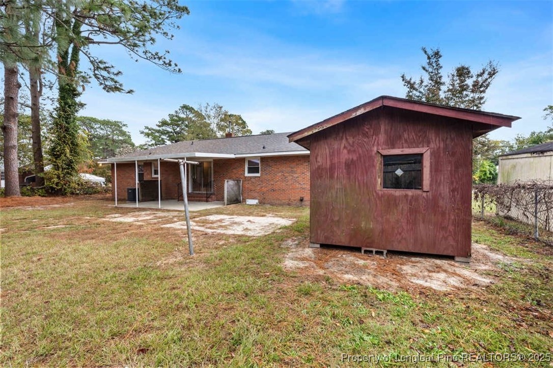 3918 Glenridge Road Fayetteville, NC 28304 - Photo 27 of 31 a view of a house with a yard