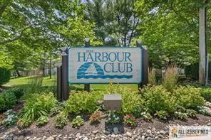 a sign broad in front of flowers