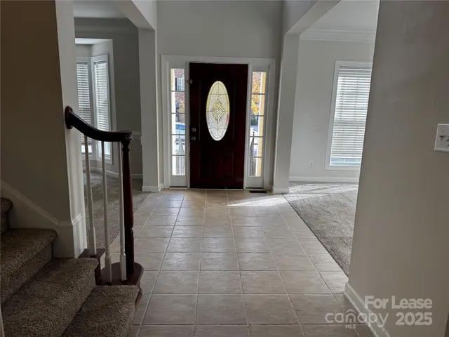 a view of a livingroom with furniture and a window