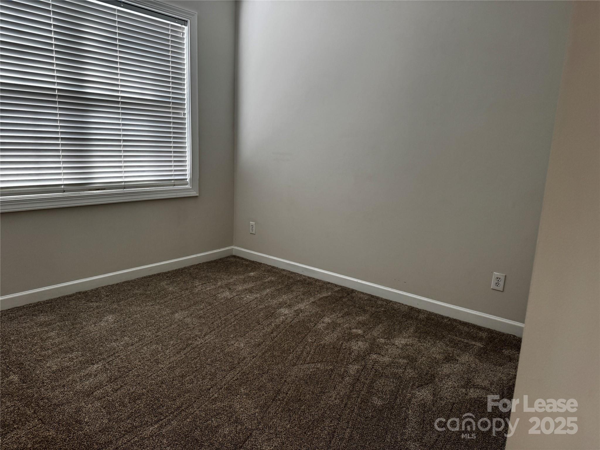 15628 Sullivan Ridge Drive Charlotte, NC 28277 - Photo 23 of 29 an empty room with a window