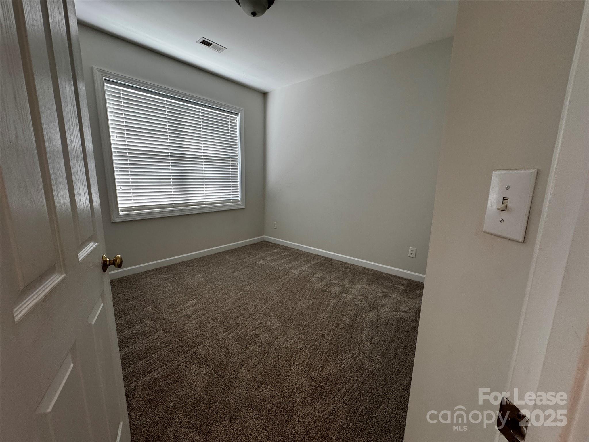 15628 Sullivan Ridge Drive Charlotte, NC 28277 - Photo 24 of 29 a view of an empty room with a window