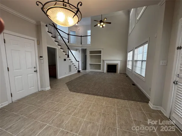 a kitchen with stainless steel appliances a stove a sink a microwave and a refrigerator