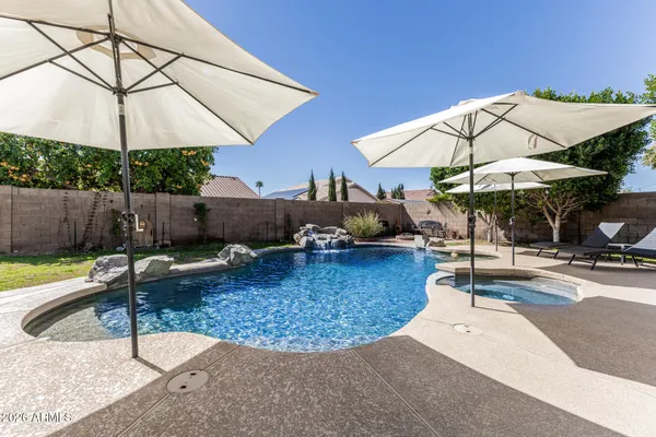 a view of a swimming pool with a patio