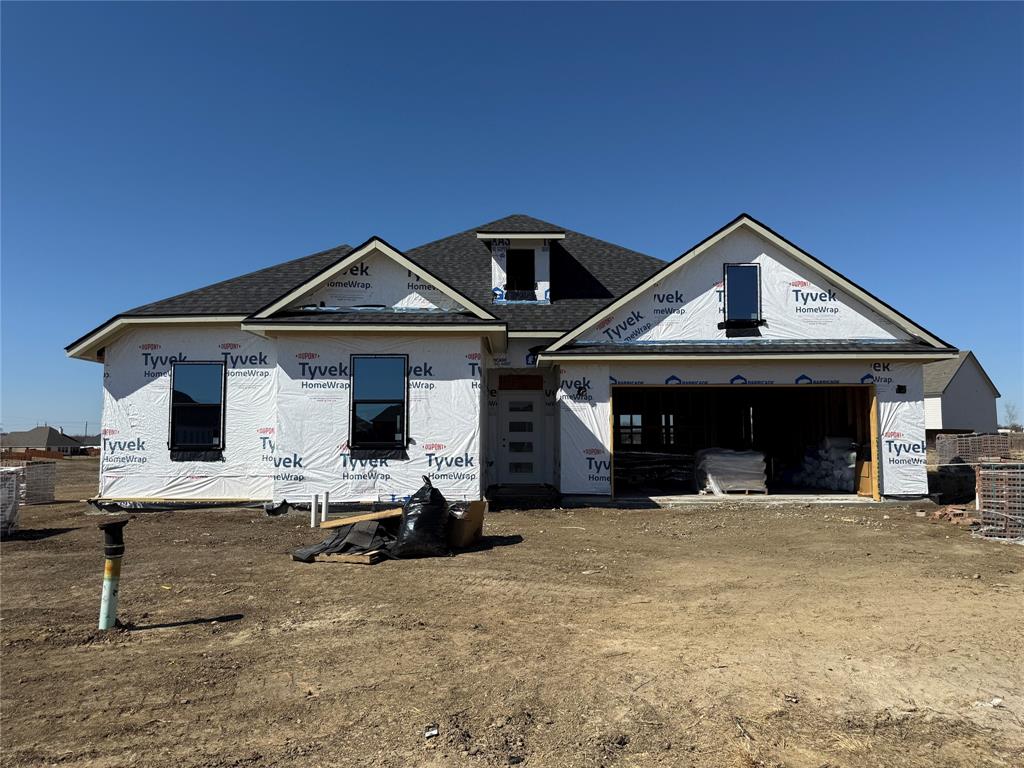 a front view of a house with garage