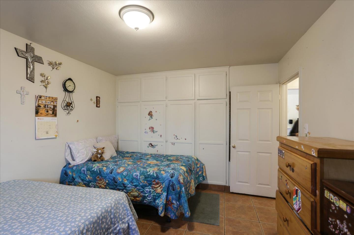 402 Haven Drive King City, CA 93930 - Photo 16 of 22 a bedroom with a bed and a dresser