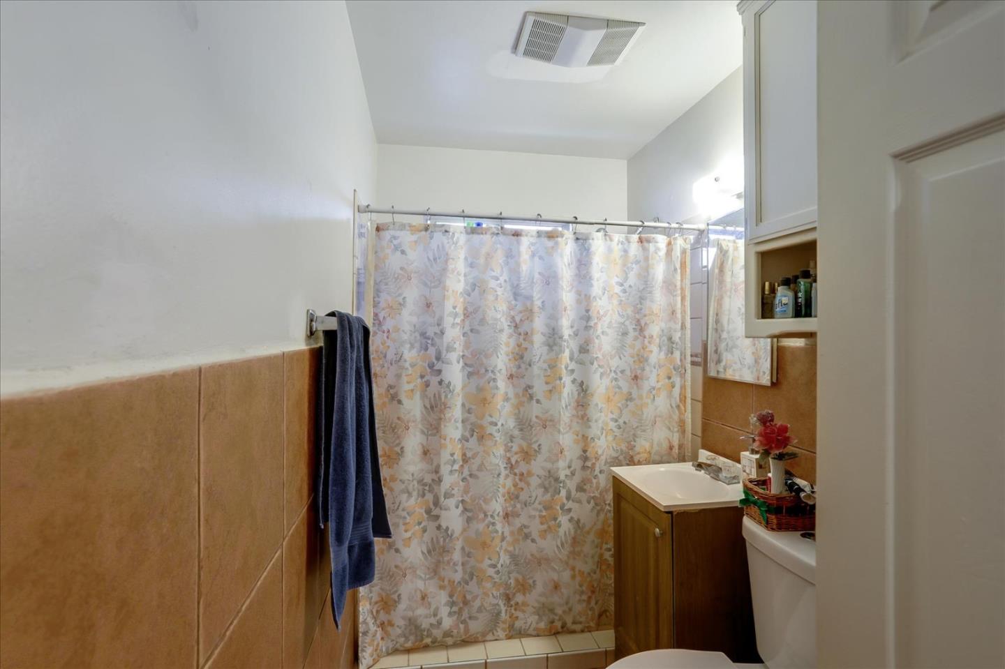 402 Haven Drive King City, CA 93930 - Photo 17 of 22 a bathroom with a shower curtain and a sink