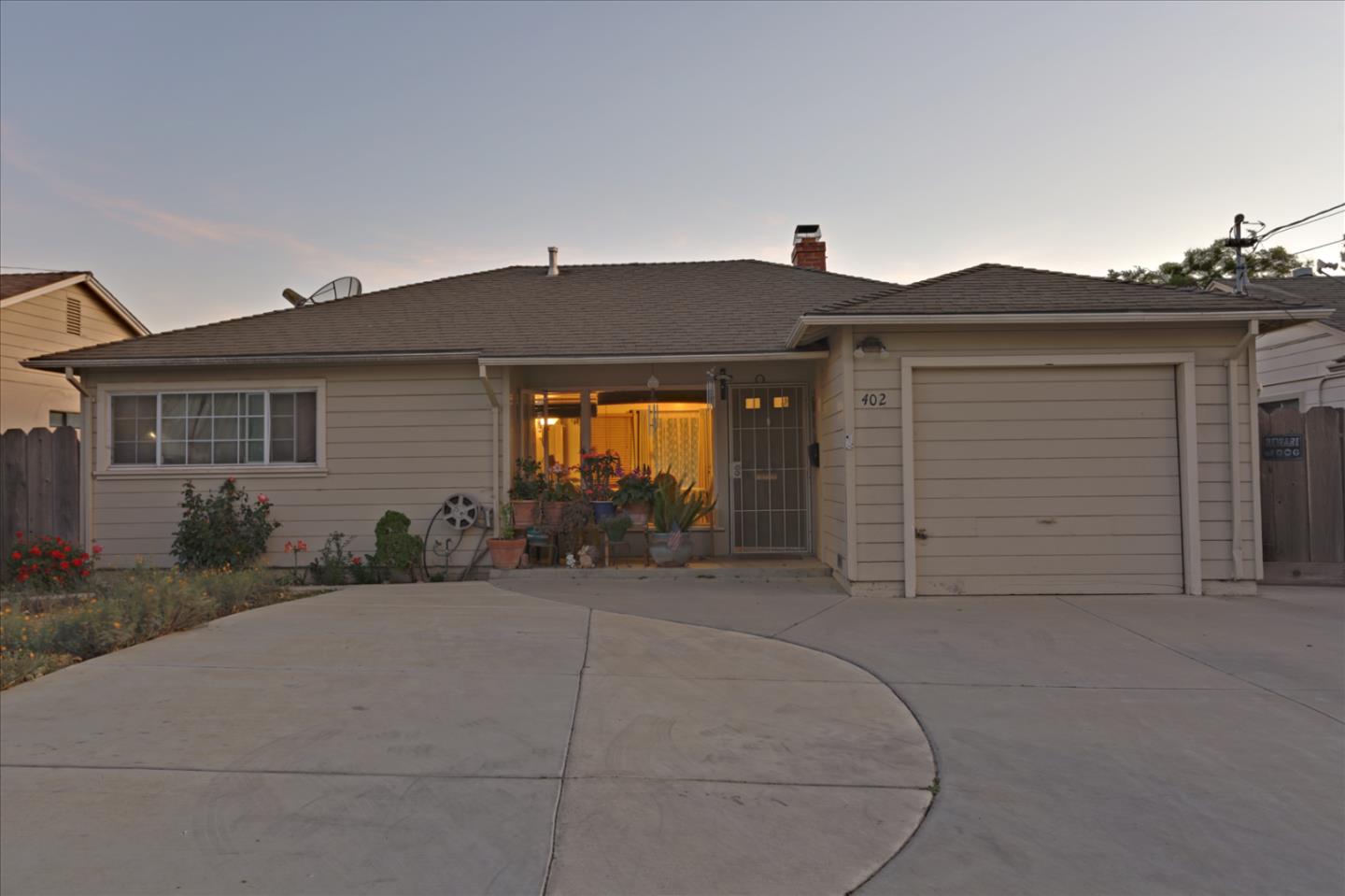 402 Haven Drive King City, CA 93930 - Photo 22 of 22 a front view of a house with a yard and garage