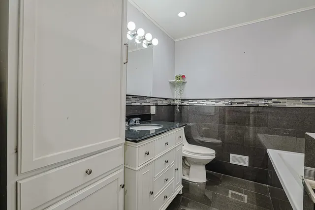 a bath tub sitting next to a shower