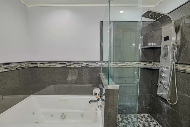 an empty room with a fireplace and wooden floor