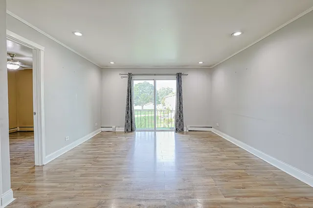 a view of dining room with furniture and wooden floor