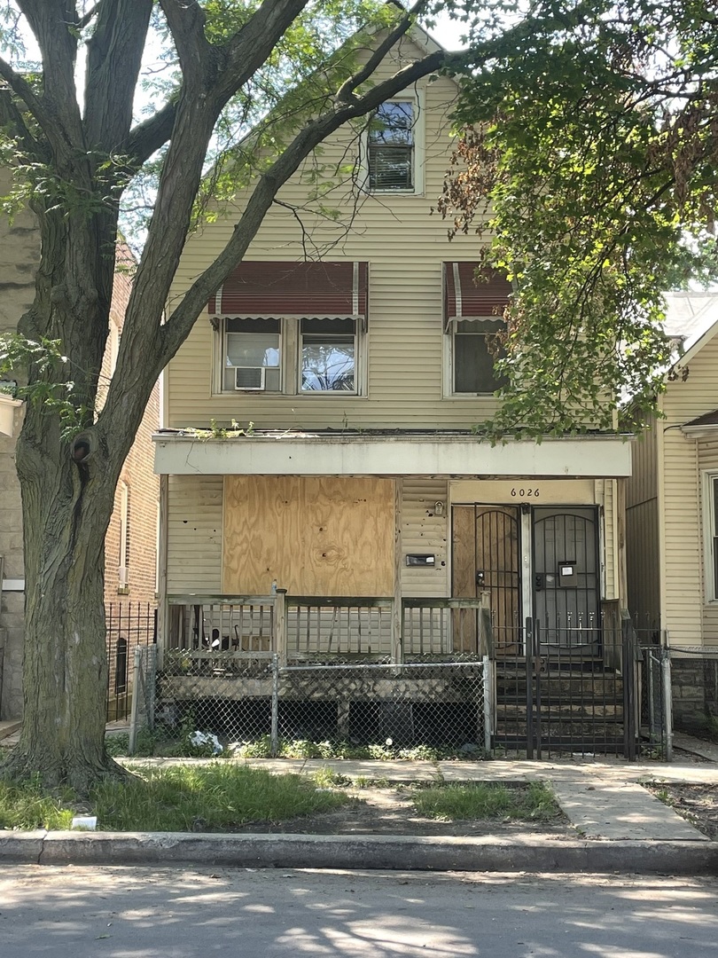a view of a house with a garden