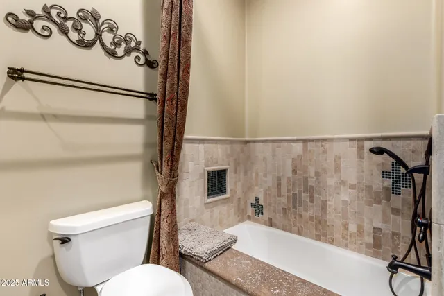 a view of a house with backyard porch and sitting area