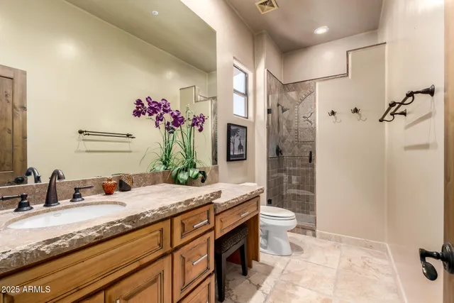 a view of a patio with table and chairs and potted plants