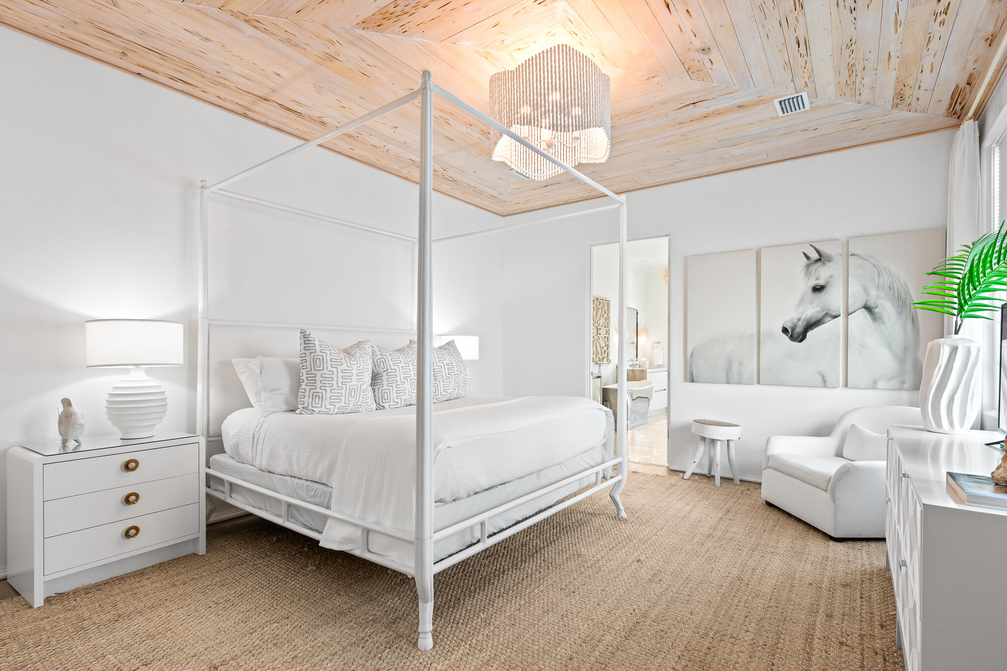 32 Shinbone Court Inlet Beach, FL 32461 - Photo 27 of 53 a bedroom with a bed and a chandelier