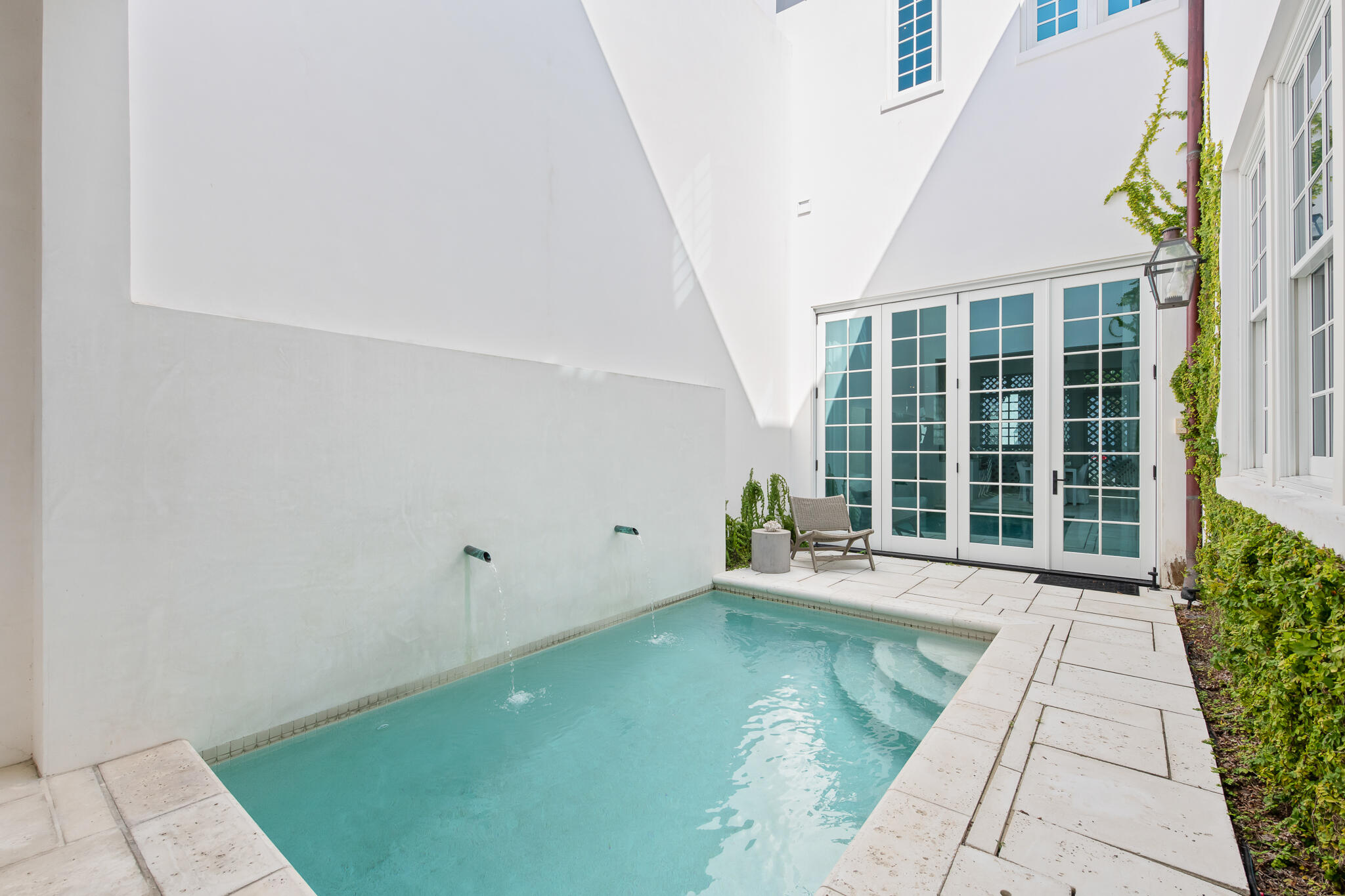 32 Shinbone Court Inlet Beach, FL 32461 - Photo 5 of 53 a view of a swimming pool with potted plants in front of house