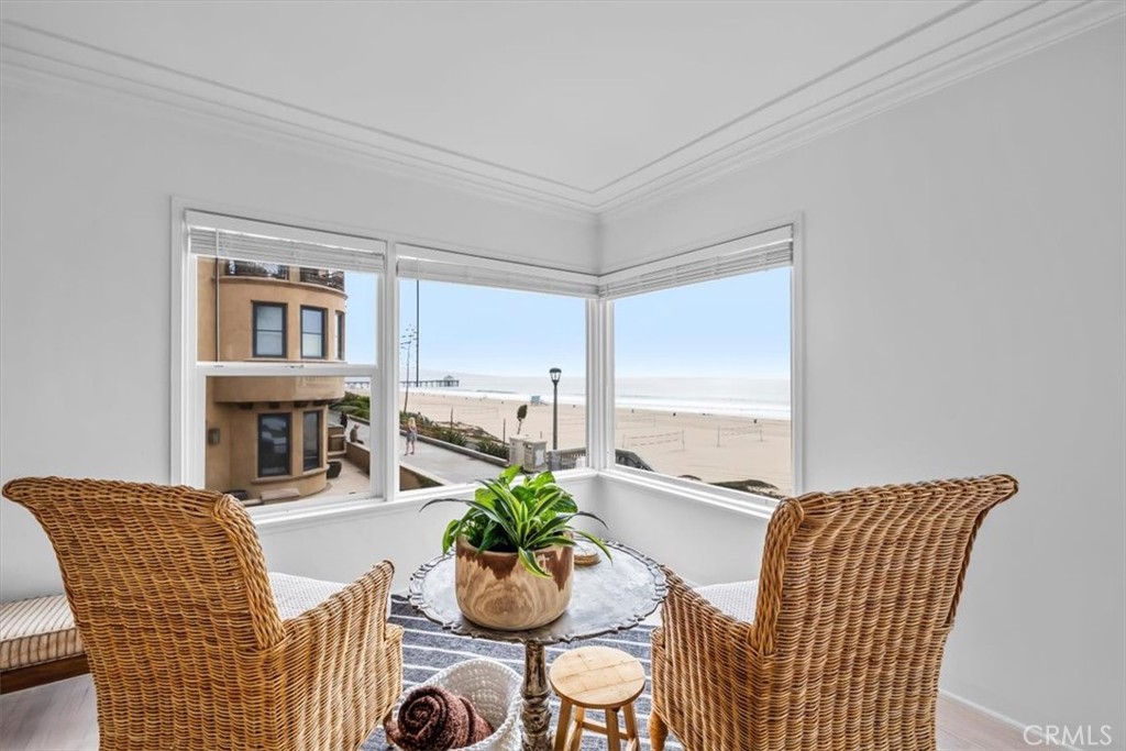 2000 The Strand Manhattan Beach, CA 90266 - Photo 14 of 57 a dining room with furniture potted plants and wooden floor