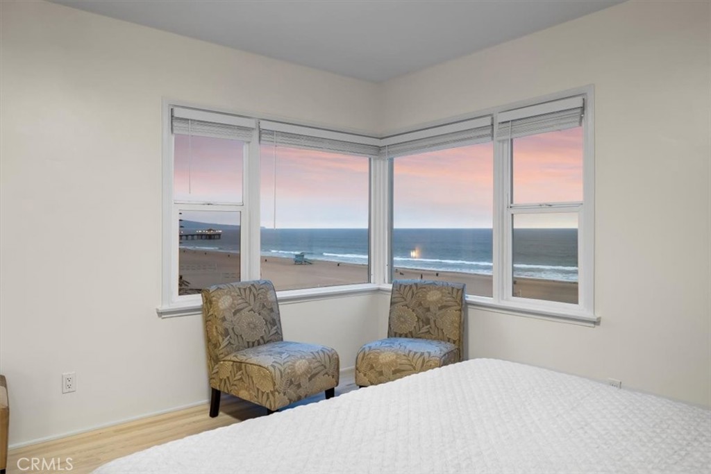 2000 The Strand Manhattan Beach, CA 90266 - Photo 26 of 57 a living room with furniture and floor to ceiling windows