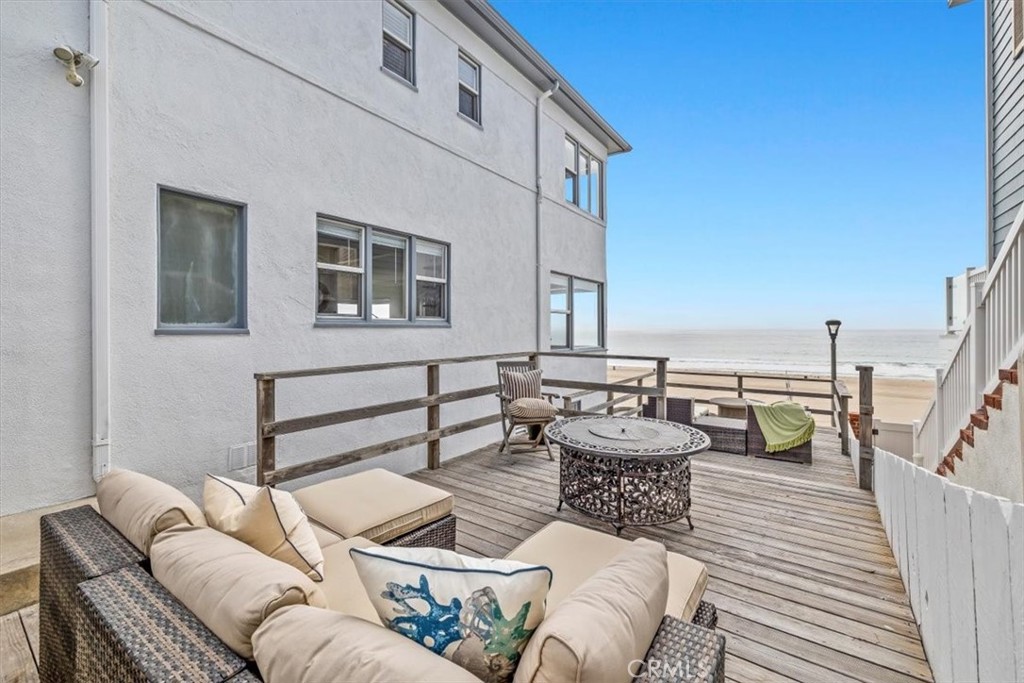 2000 The Strand Manhattan Beach, CA 90266 - Photo 40 of 57 a balcony with furniture and view of living room
