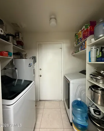 a kitchen with a stove and a refrigerator