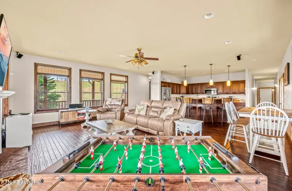 a table and chair sitting in front of a window