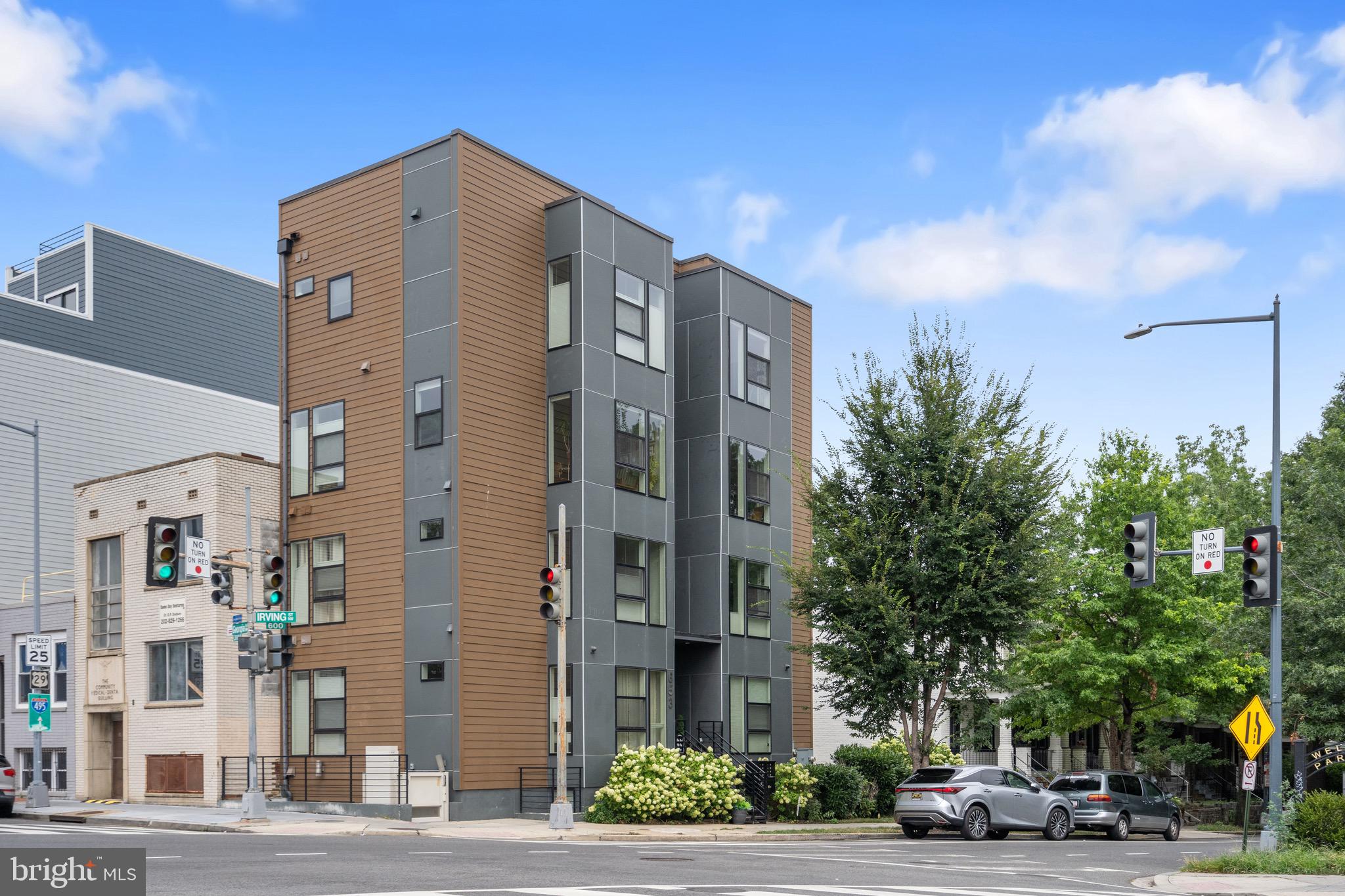 653 Irving Street Northwest, Unit 7 Washington, DC 20010 - Photo 27 of 31 a city street lined with buildings and trees