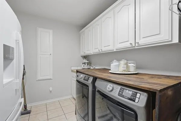 a kitchen with granite countertop a stove and a refrigerator