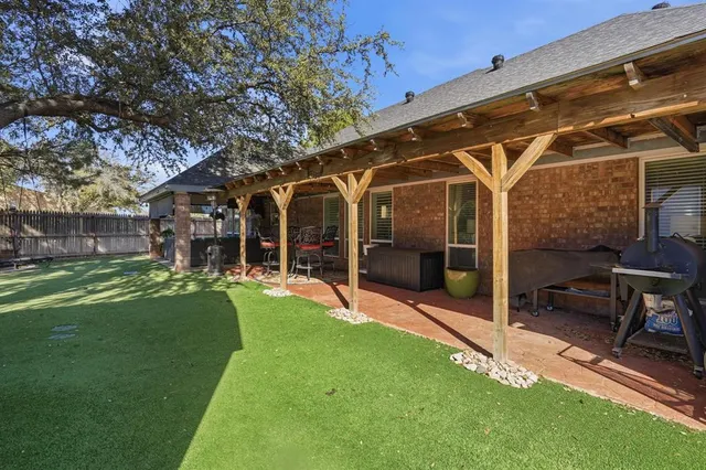 a view of a house with a yard porch and sitting area