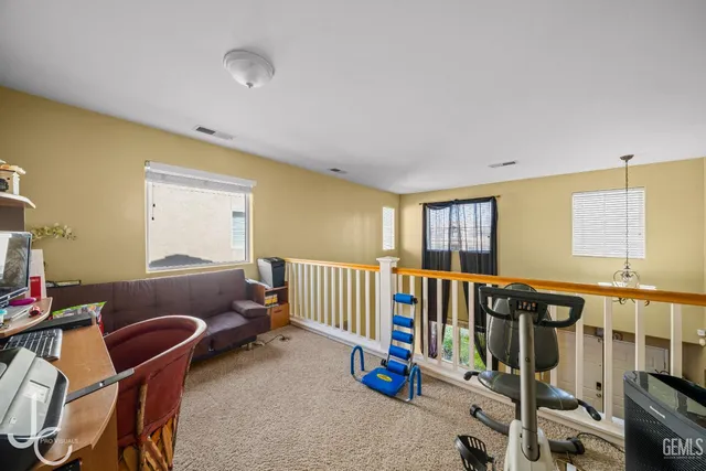 a bedroom with furniture and a window