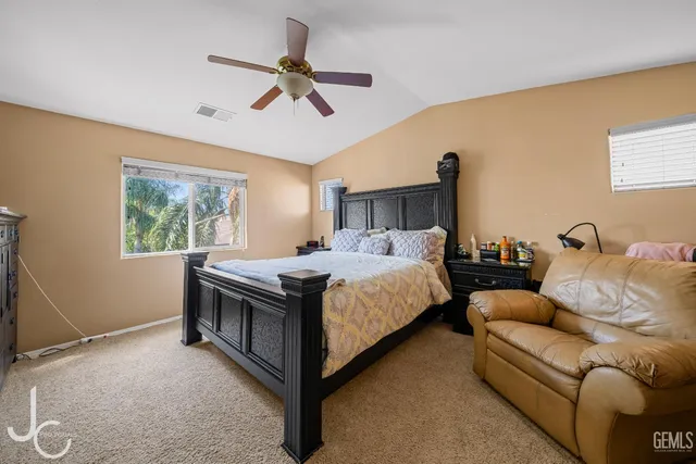 a bed room with a bed and a couch