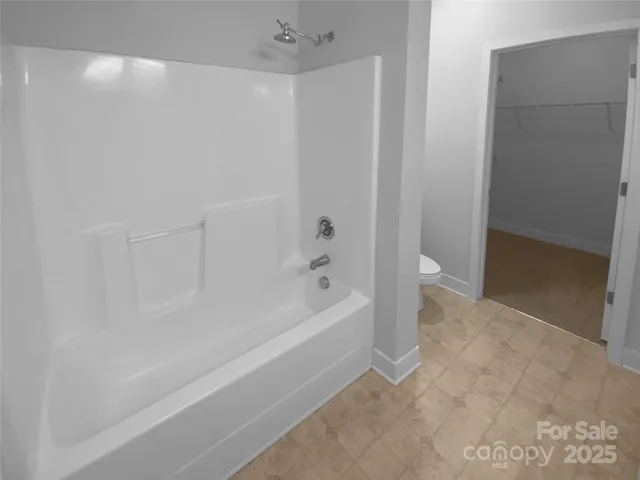 a bathroom with a double vanity sink and mirror