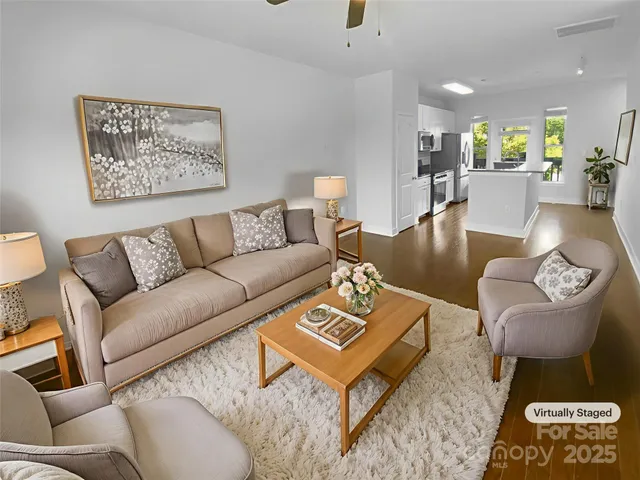 a living room with furniture and a rug