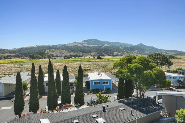 an aerial view of residential house with pool and yard