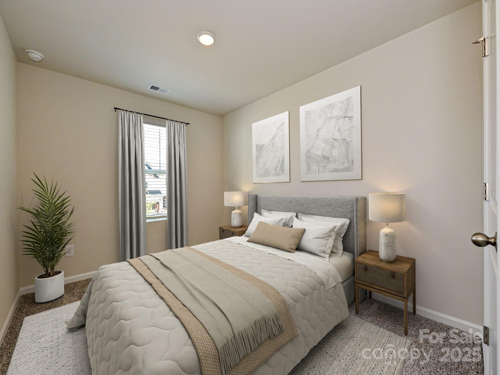 3550 Backwater Street Concord, NC 28027 - Photo 8 of 11 a bedroom with a large bed and a potted plant