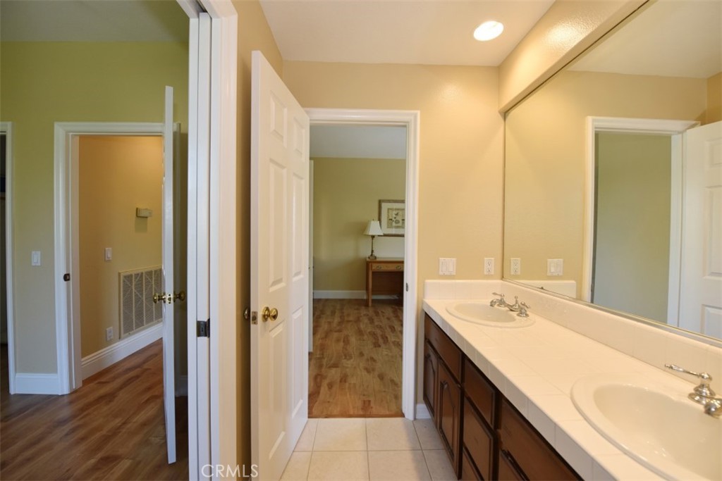 12 Brigadier Irvine, CA 92603 - Photo 46 of 50 a bathroom with a double vanity sink a mirror and a shower