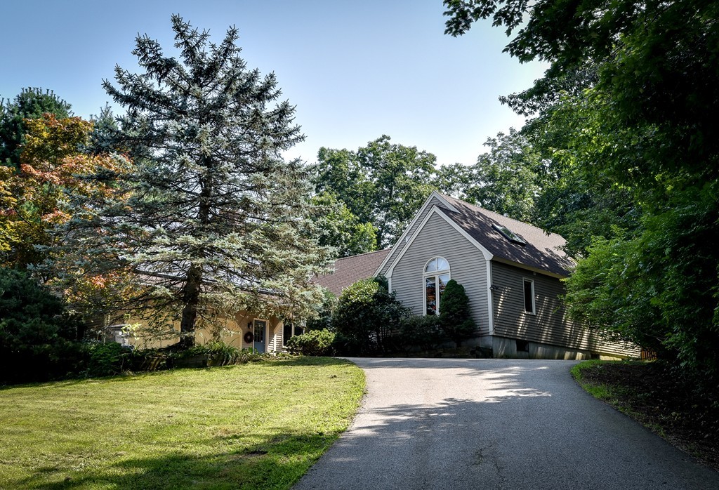 41 Garvey Road Framingham, MA 01701 - Photo 1 of 22 a front view of a house with a garden
