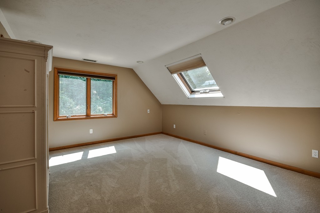 41 Garvey Road Framingham, MA 01701 - Photo 17 of 22 an empty room with windows and cabinet