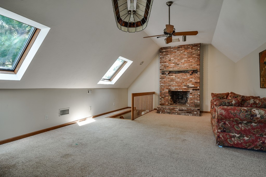 41 Garvey Road Framingham, MA 01701 - Photo 9 of 22 a living room with furniture and a fireplace