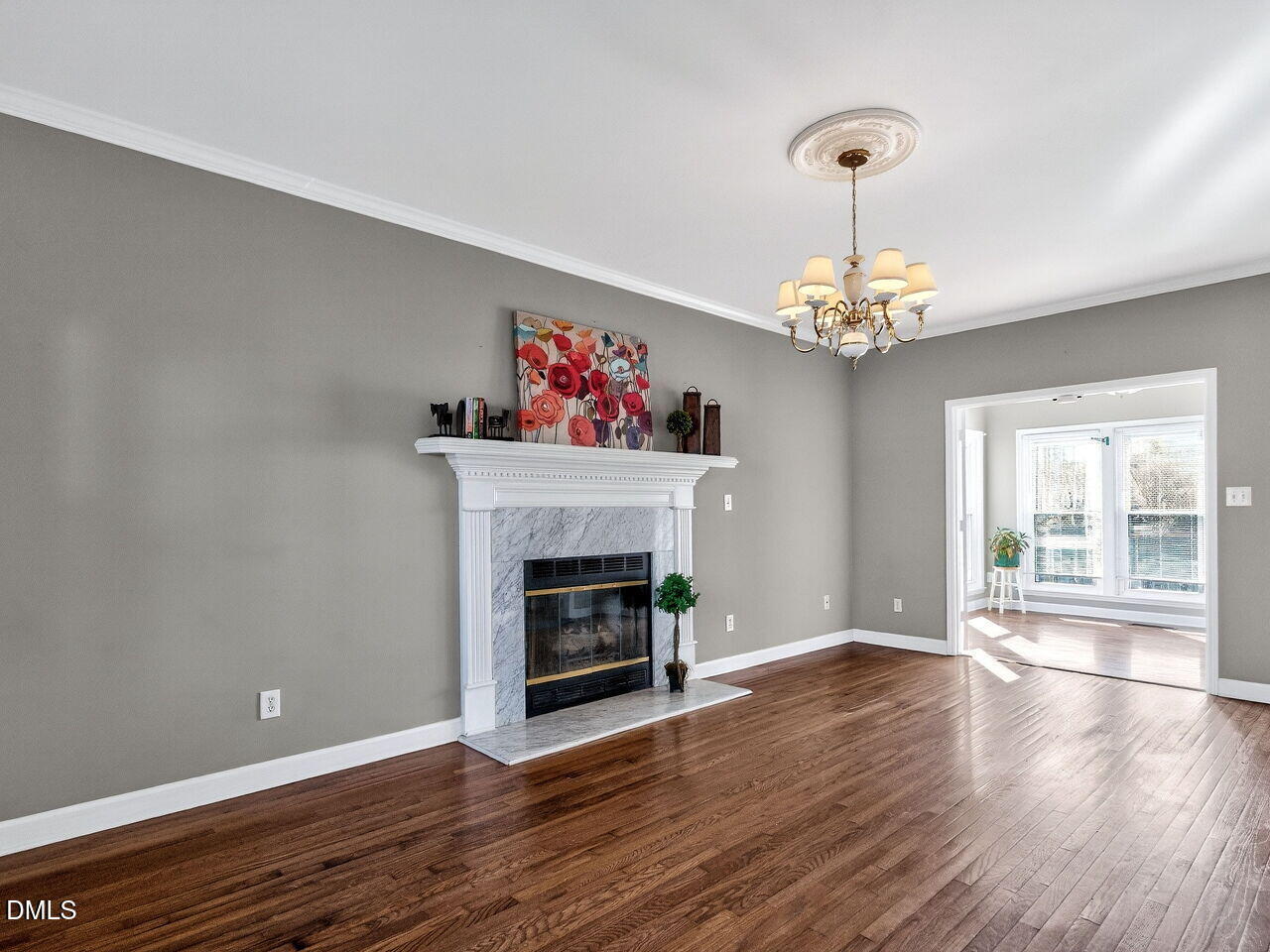 4500 Rivershyre Way Raleigh, NC 27616 - Photo 5 of 42 a view of a livingroom with wooden floor and a fireplace