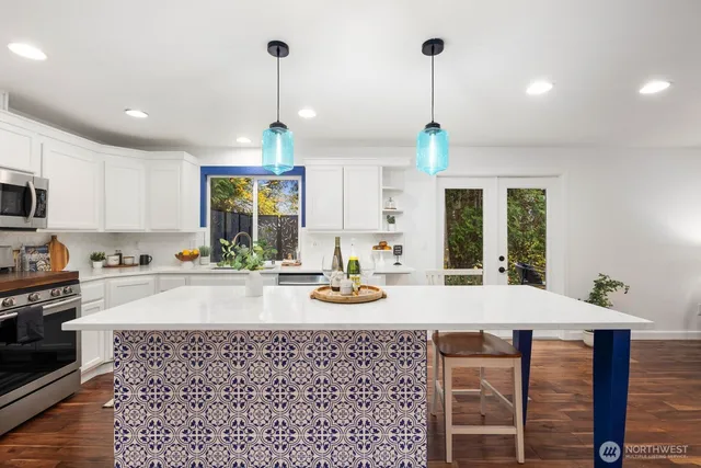 a kitchen with a sink cabinets and window