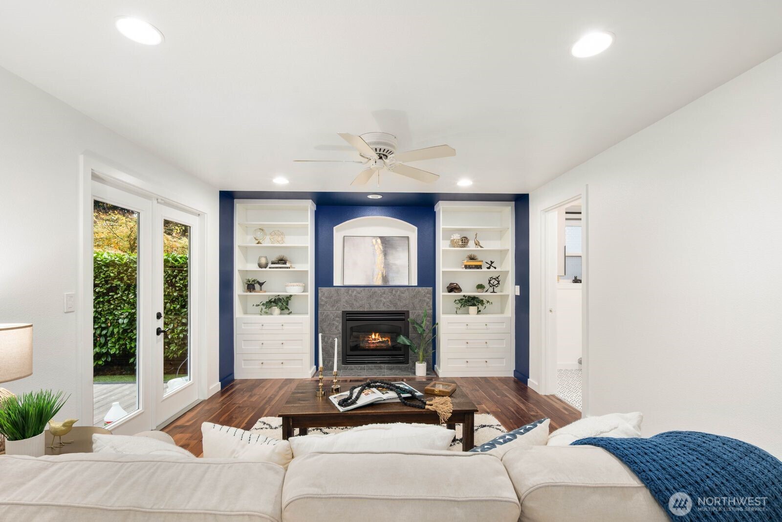 1947 Northeast 23rd Street Renton, WA 98056 - Photo 15 of 36 a living room with furniture and a fireplace