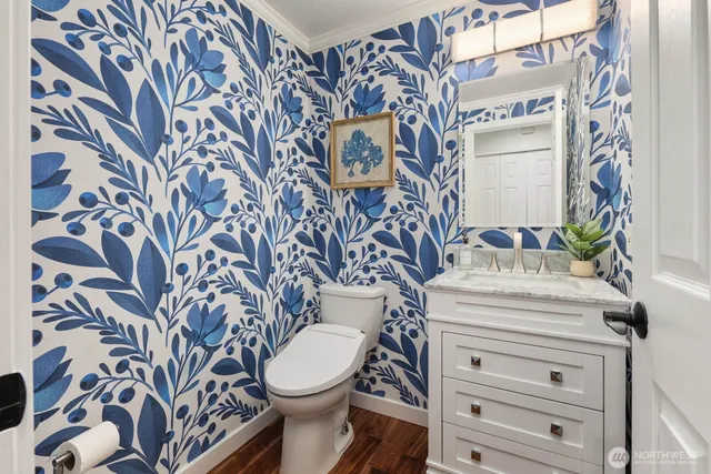 a bathroom with a toilet and a sink